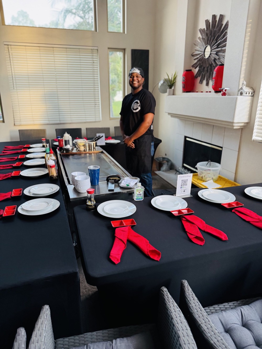 At-home hibachi table fully set with red napkins before guests arrive