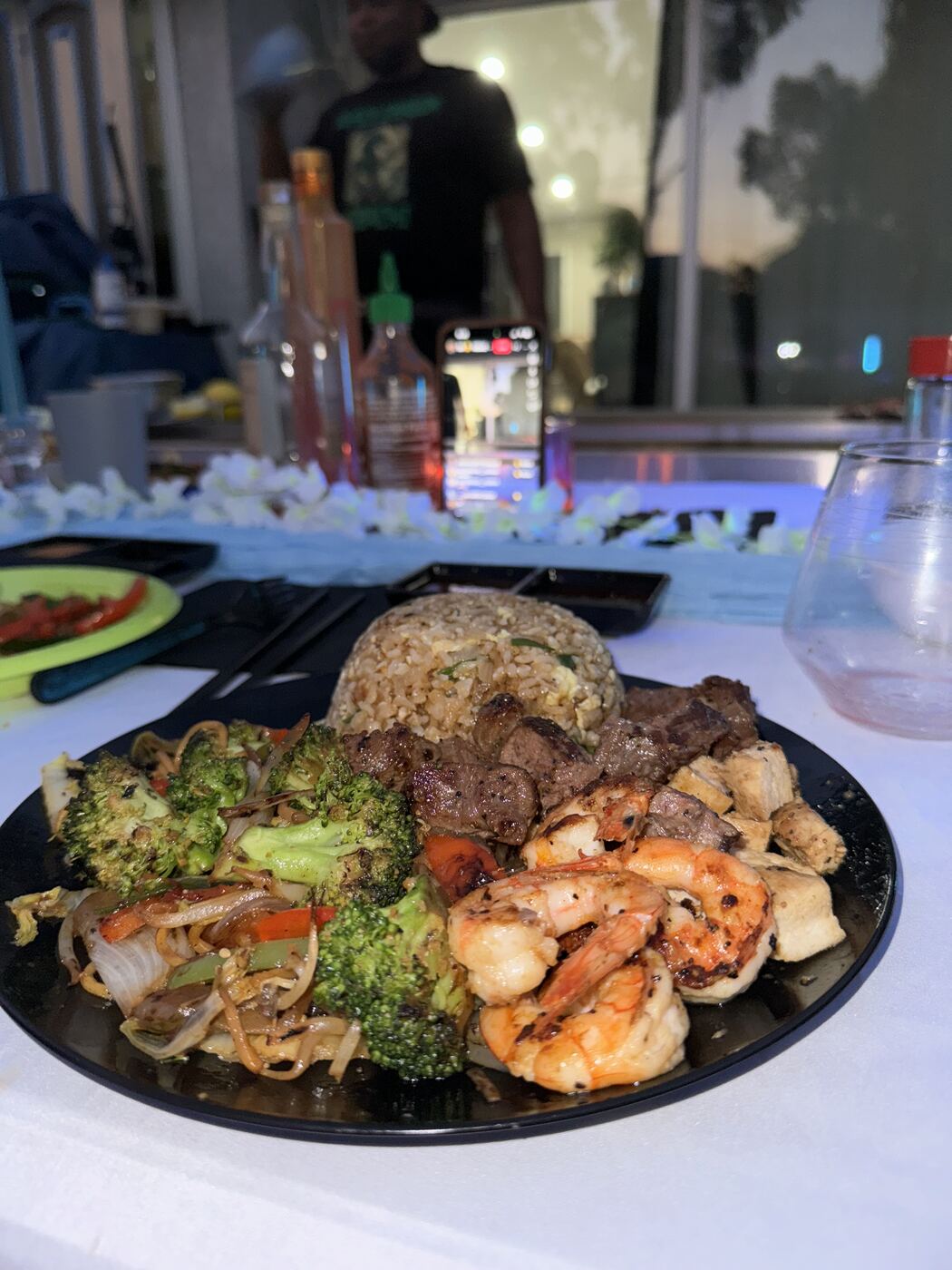 Loaded hibachi plate with steak, shrimp, chicken, fried rice and broccoli